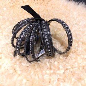 Stack of 14 black & rhinestone bangles.